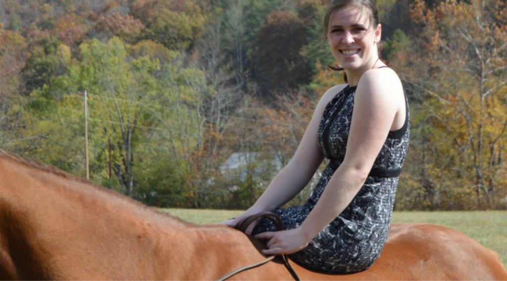 girl sitting on horse