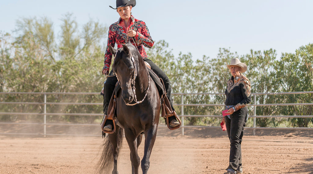 Western horseback rider with trainer