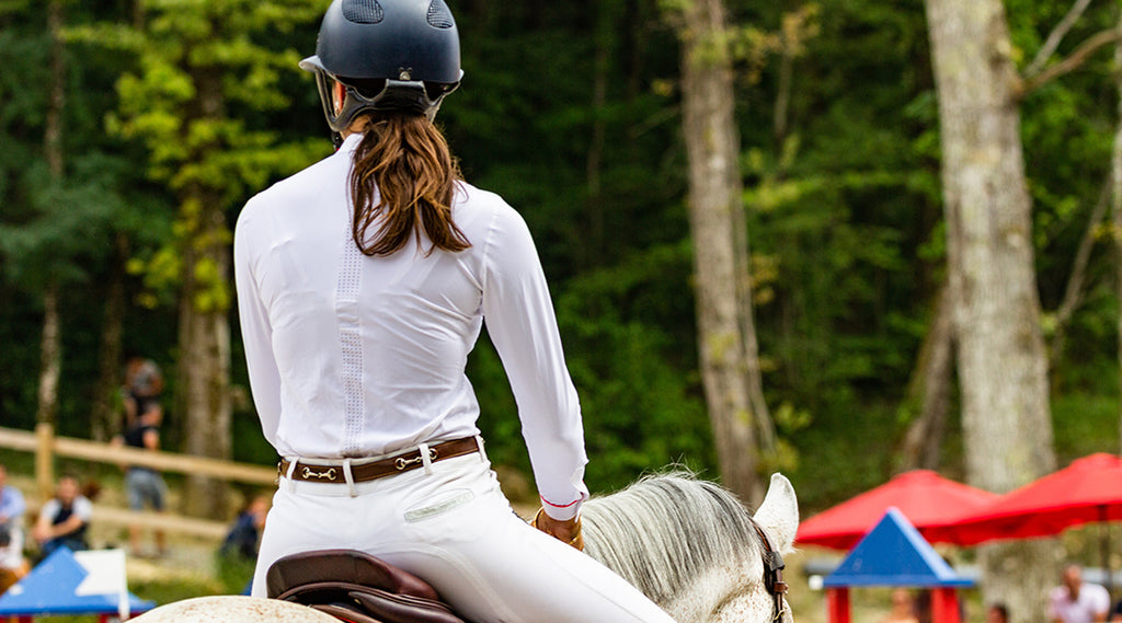 woman riding at horse event